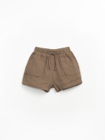 Cal��o de tecido com bolsos