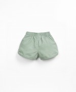 Shorts with decorative coconut button