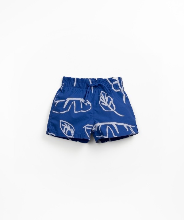 Swim shorts with leaf print