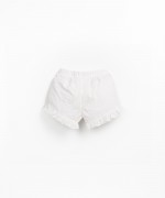 Pantaln corto de tela con volantes