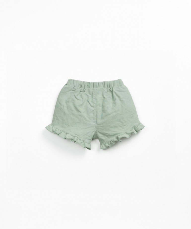 Pantaln corto de tela con insertos laterales