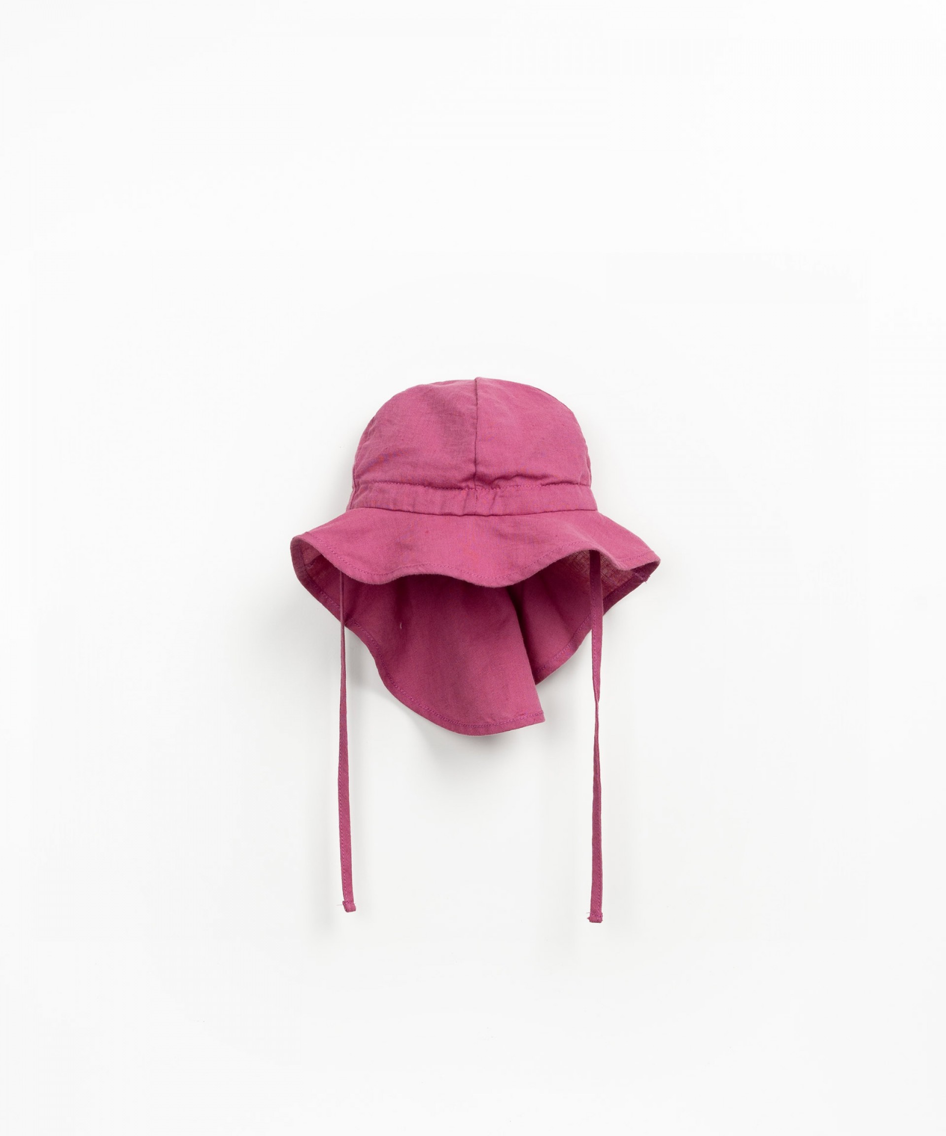 Fabric hat with asymmetric brim
