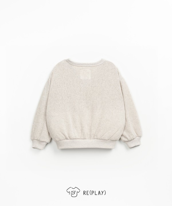 Veste en maille avec des boutons en coco