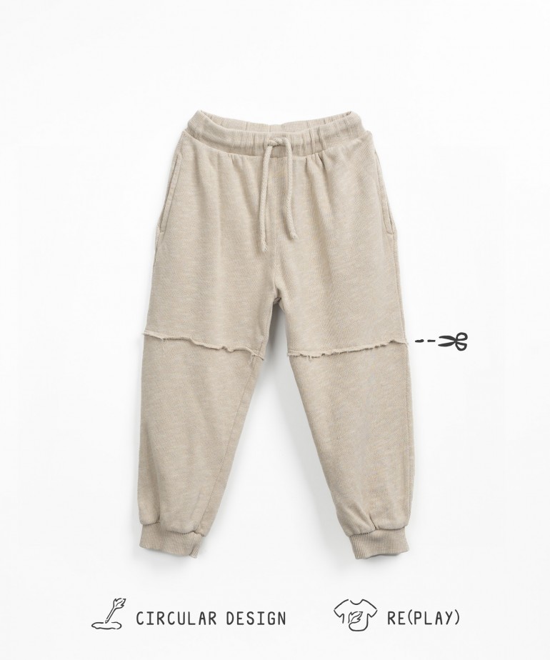 Wide cotton blend trousers with elastic cuffs