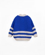 Knitted jacket with coconut button opening