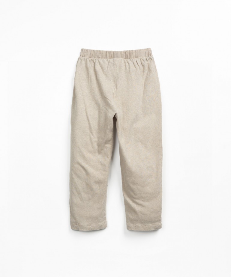 Cala em mistura de malha e tecido com bolsos