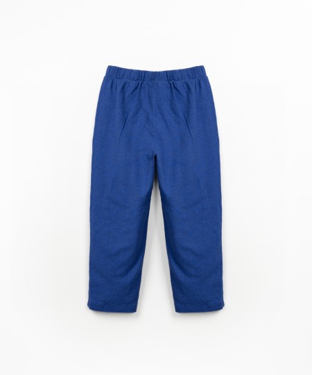 Calça em mistura de malha e tecido com bolsos