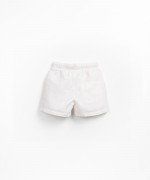 Fabric shorts with decorative coconut button