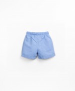 Fabric shorts with decorative coconut button