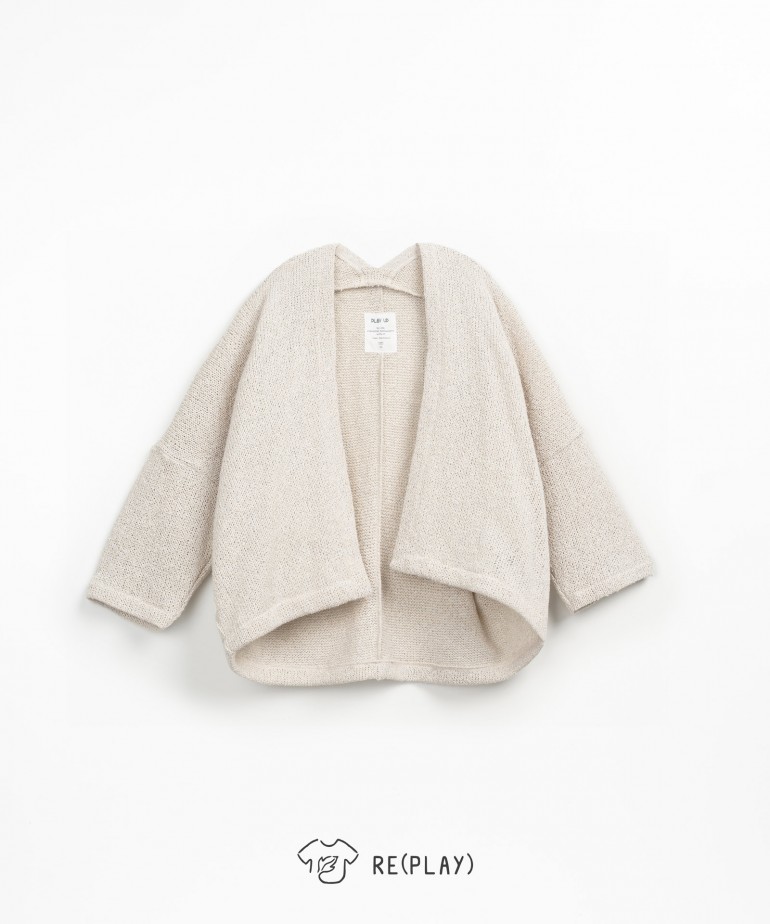Knit jacket with coconut buttons and bow on the back