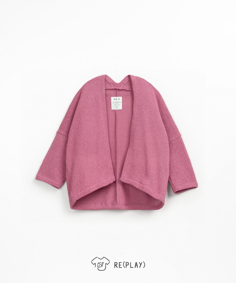 Knit jacket with coconut buttons and bow at the back