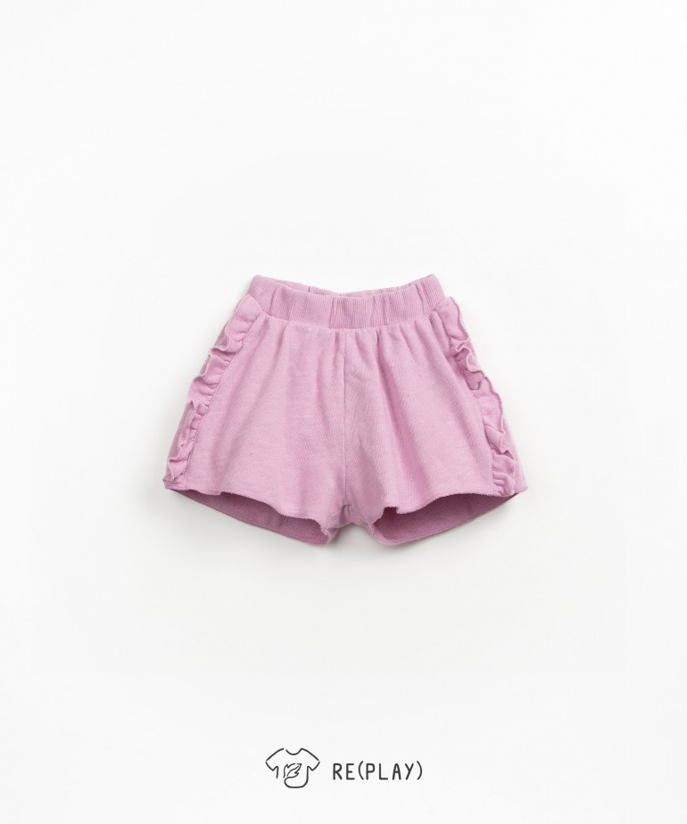 Shorts with side fringes in organic cotton blend