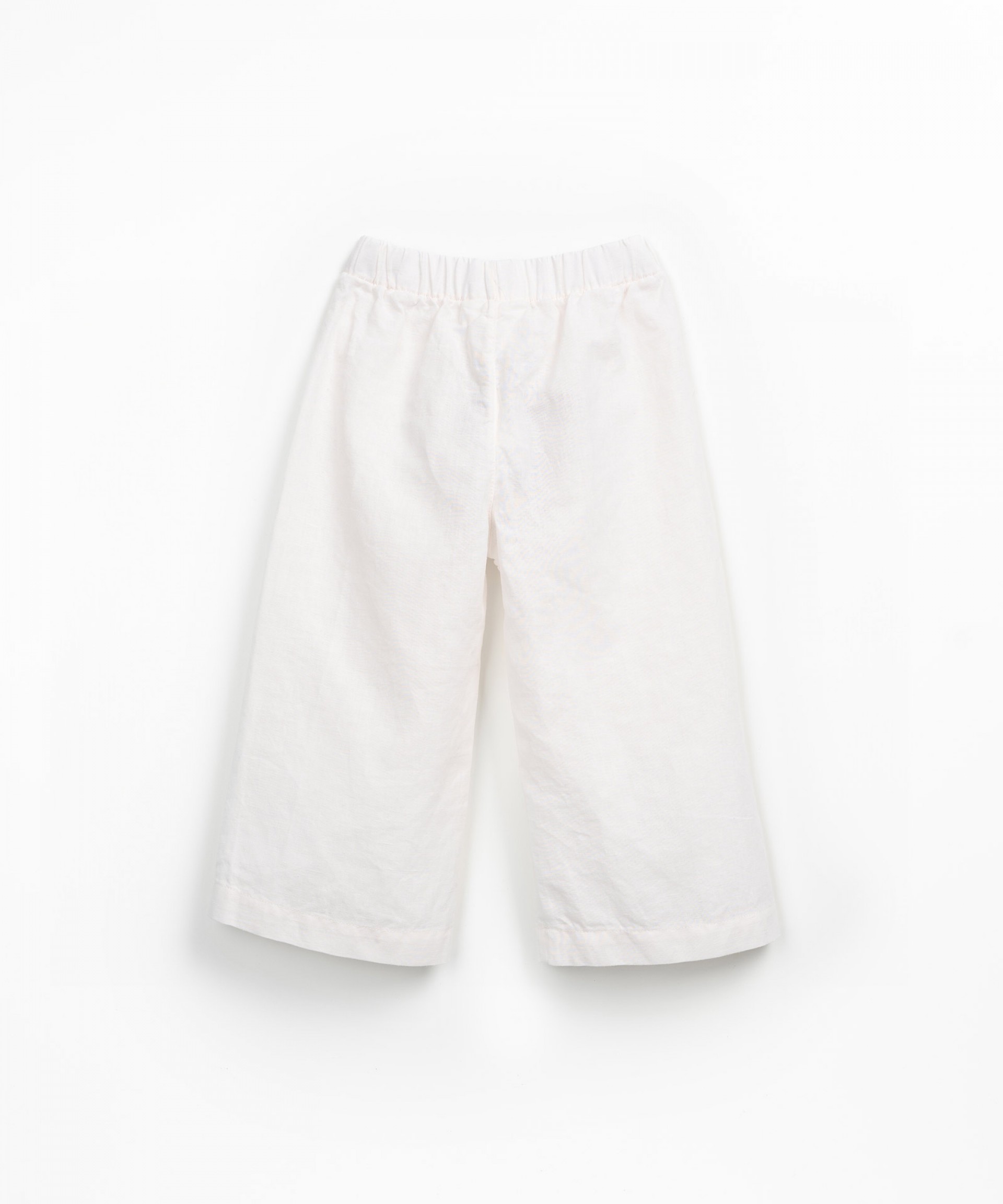Fabric trousers with decorative drawstring