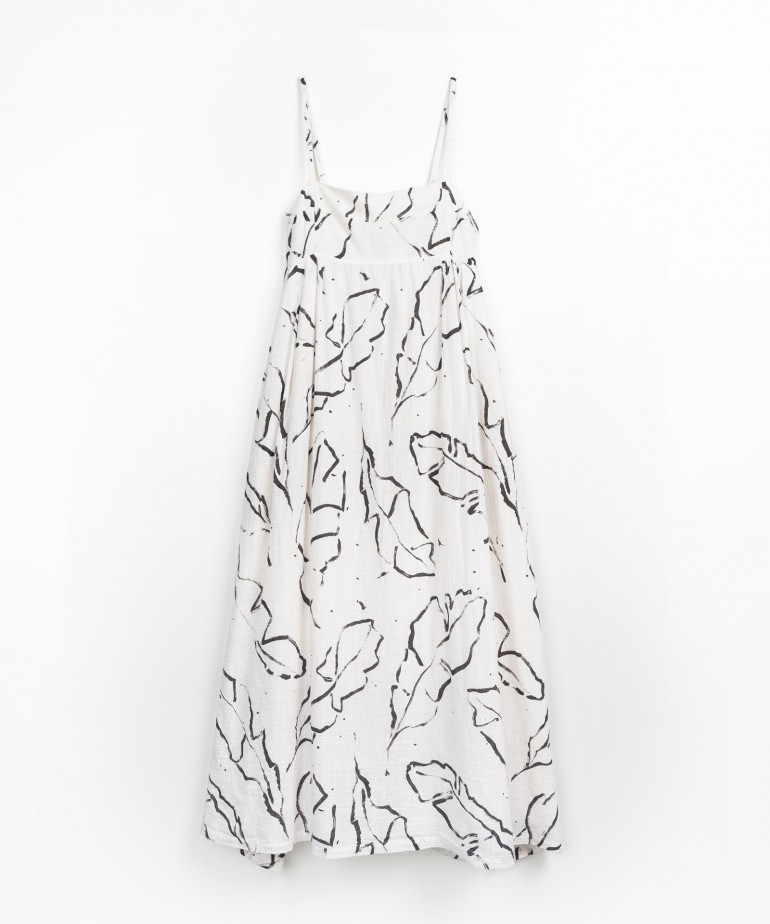 Dress with leaf pattern in organic cotton and coconut buttons