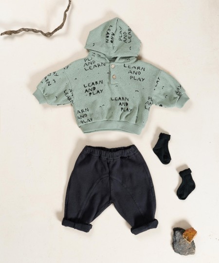 Knitted sweater with blend of natural and recycled fibers