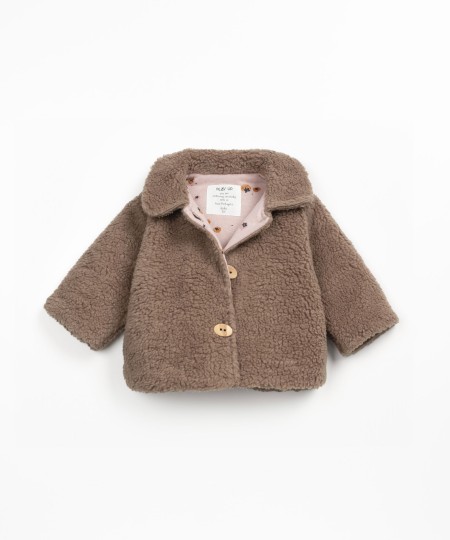 Fur jacket with wooden buttons