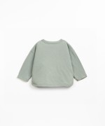 Knit sweater with shoulder opening