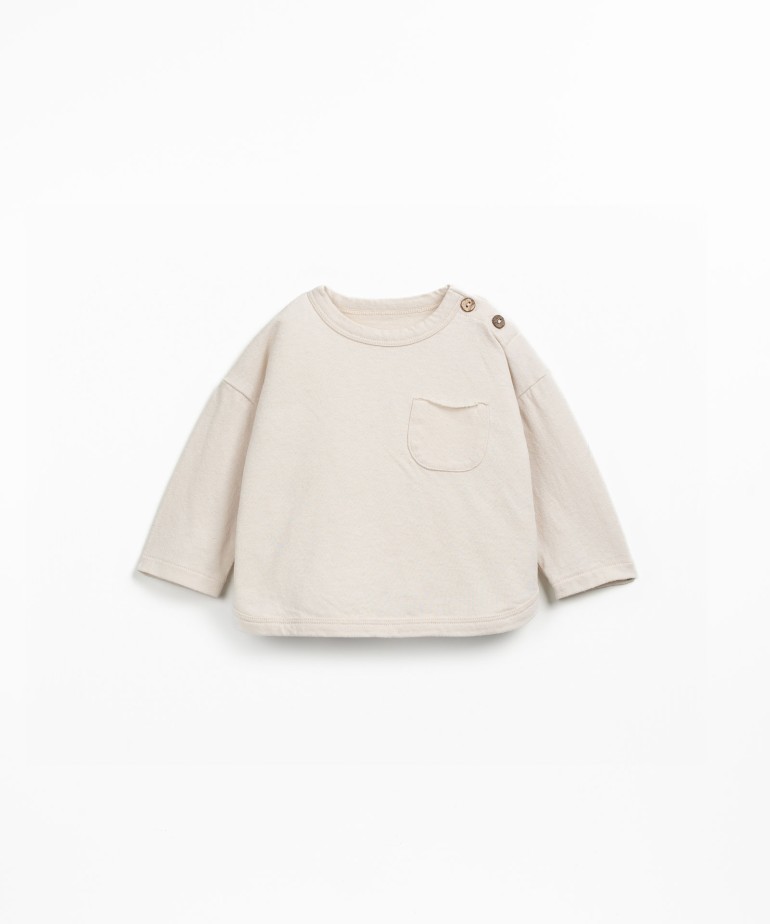 Knit sweater with a blend of natural and recycled fibers