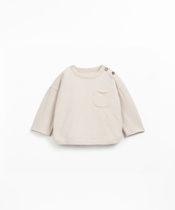 Knit sweater with a blend of natural and recycled fibers