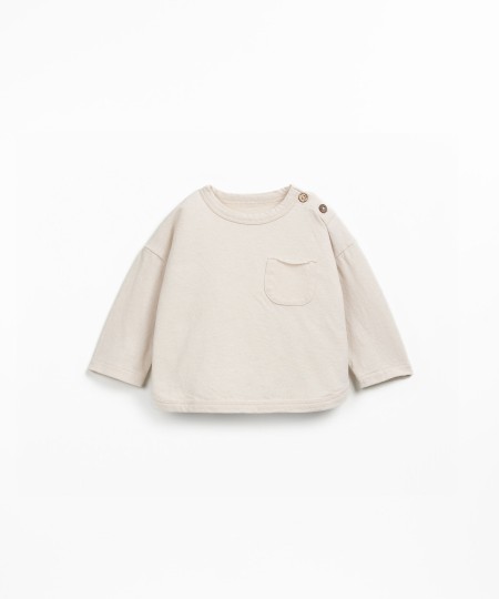 Knit sweater with a blend of natural and recycled fibers