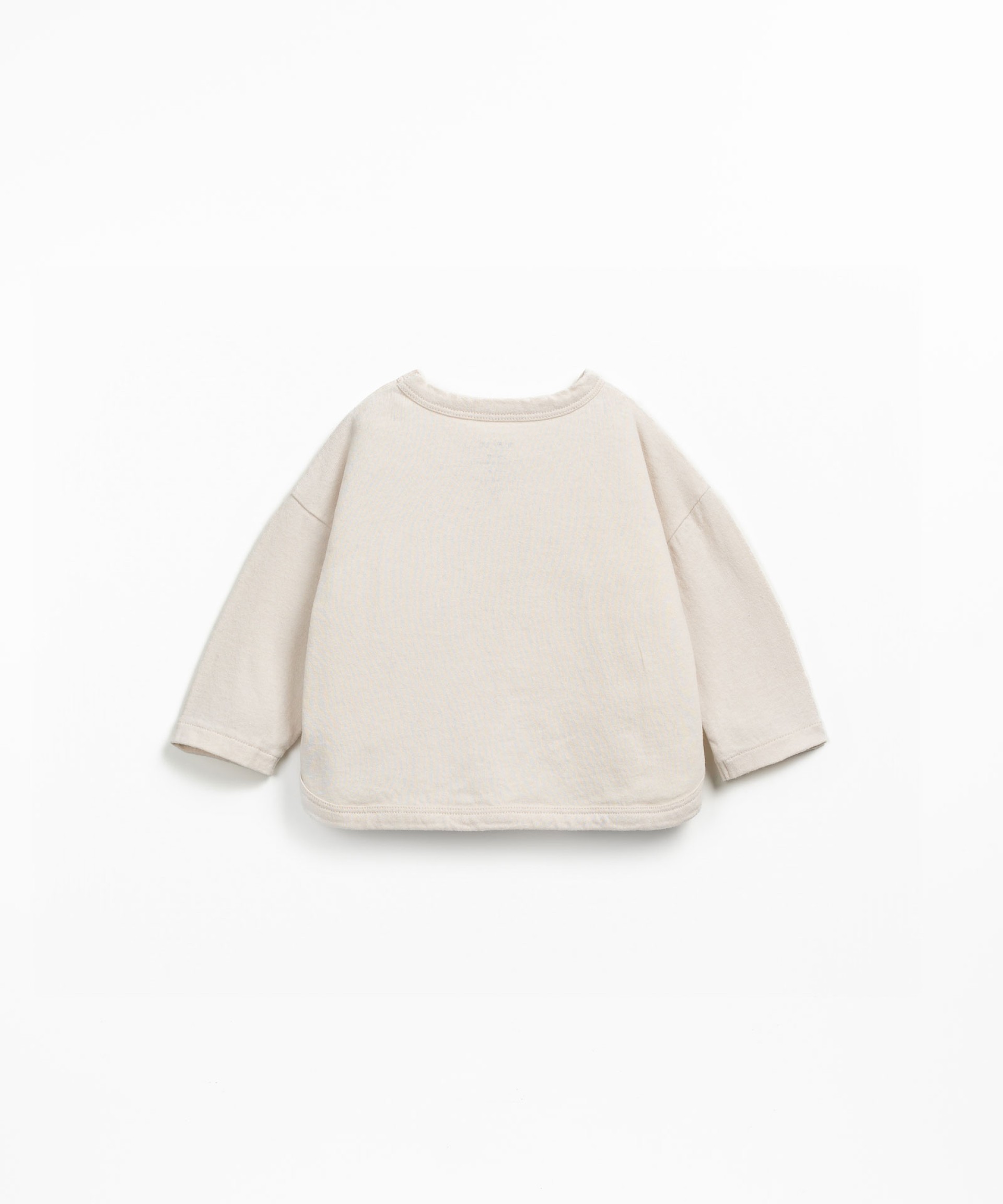 Knit sweater with shoulder opening