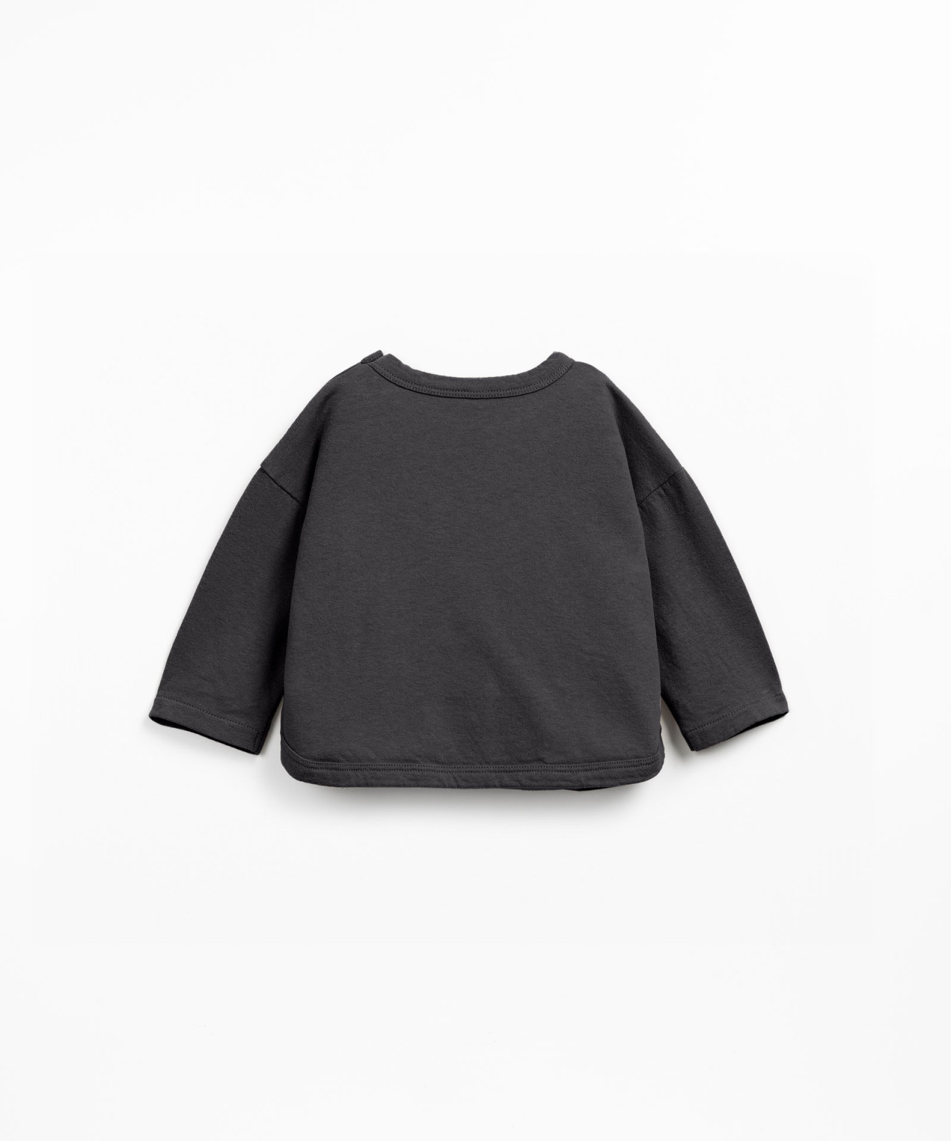 Knit sweater with shoulder opening