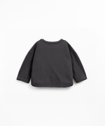 Knit sweater with shoulder opening