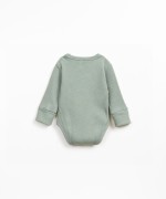 Ribbed cotton bodysuit with organic cotton and shoulder opening