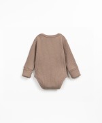 Ribbed organic cotton bodysuit with shoulder opening