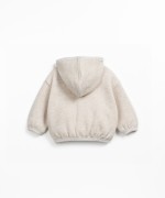 Fleece jacket in recycled cotton with hood, front zipper and side pockets