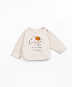 T-shirt with front design and shoulder opening