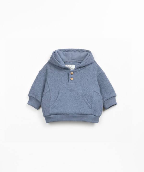 Knit sweater with organic and regenerative cotton