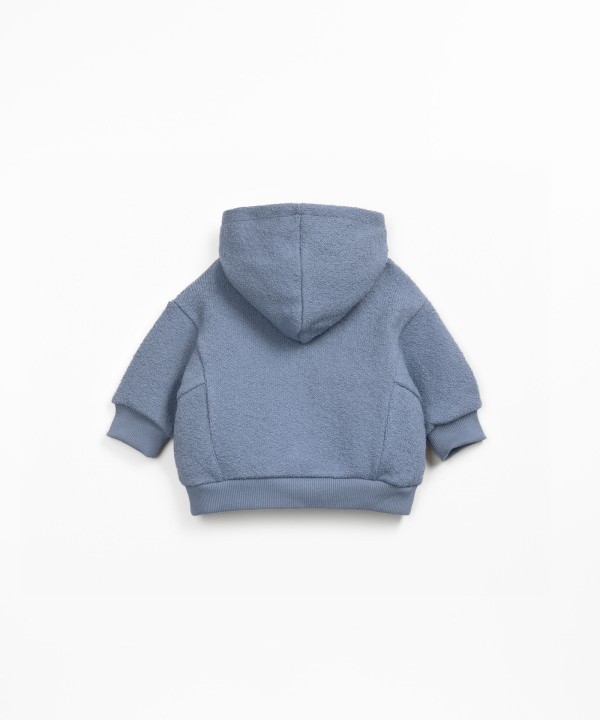 Knit sweater with organic and regenerative cotton