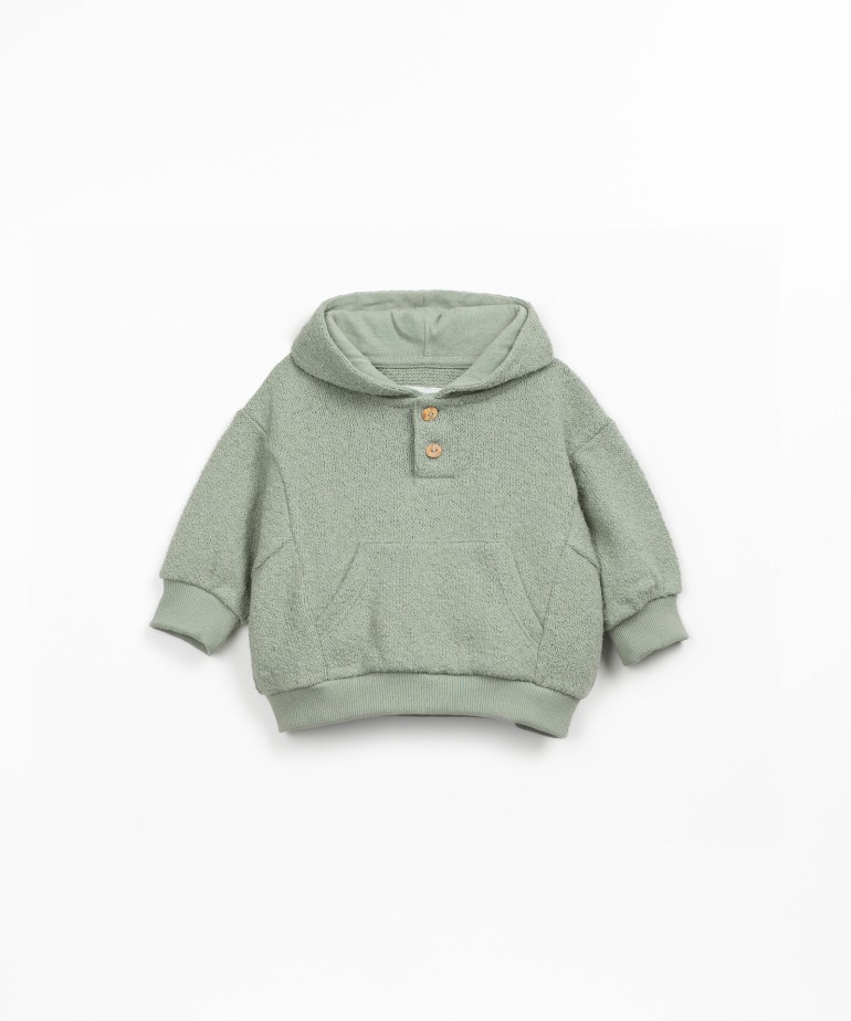 Knit sweater with organic and regenerative cotton
