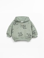 Knitted sweater with blend of natural and recycled fibers