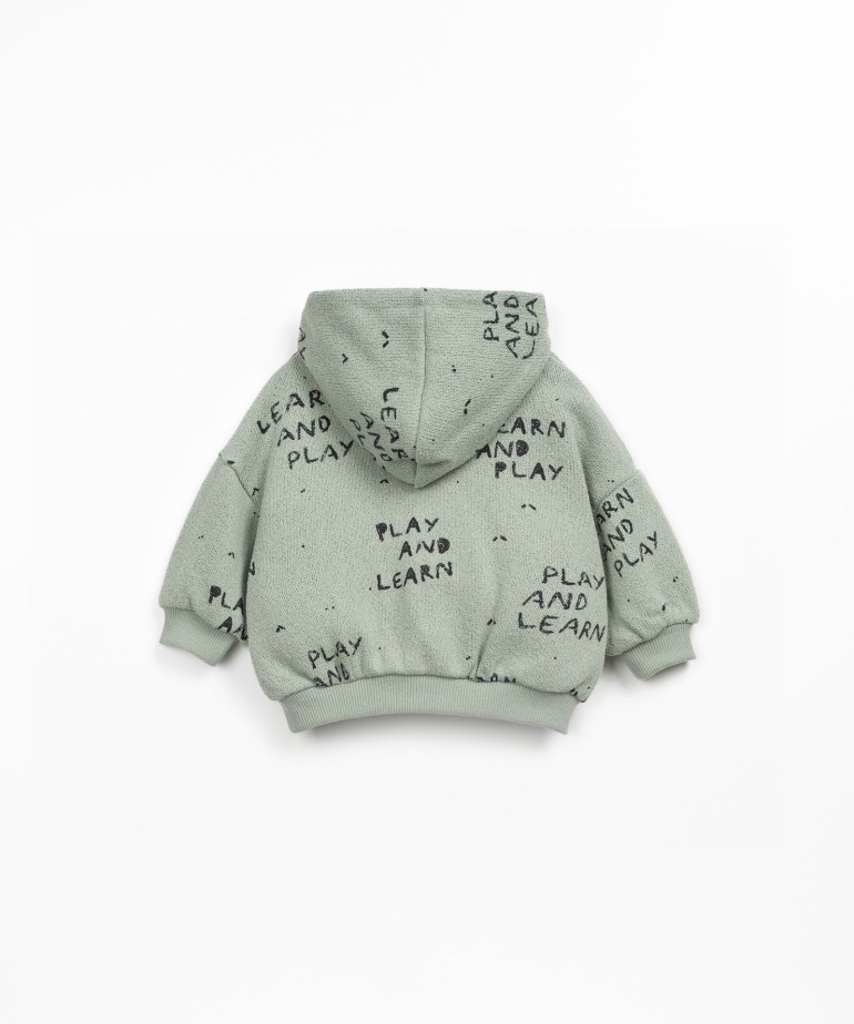 Knitted sweater with blend of natural and recycled fibers