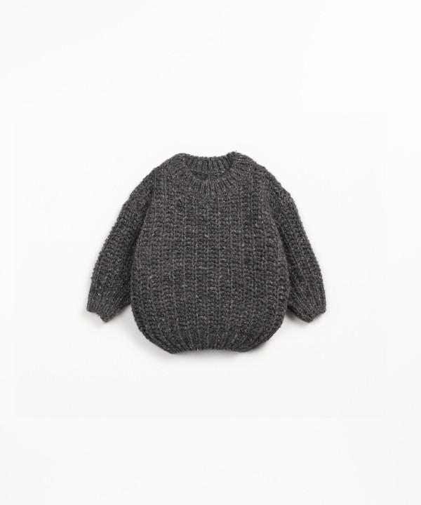 Knit sweater with recycled fibers