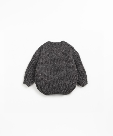 Knit sweater with recycled fibers