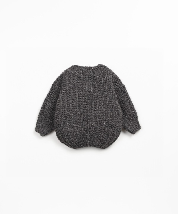 Knit sweater with recycled fibers