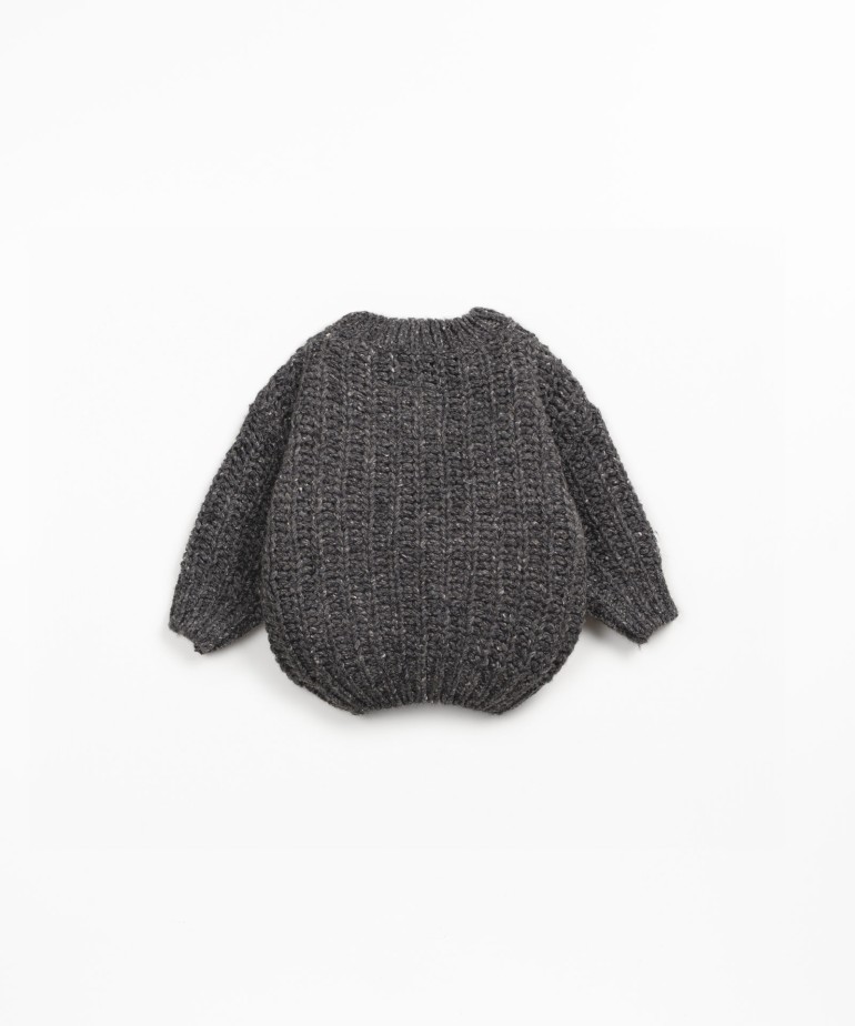 Knit sweater with recycled fibers