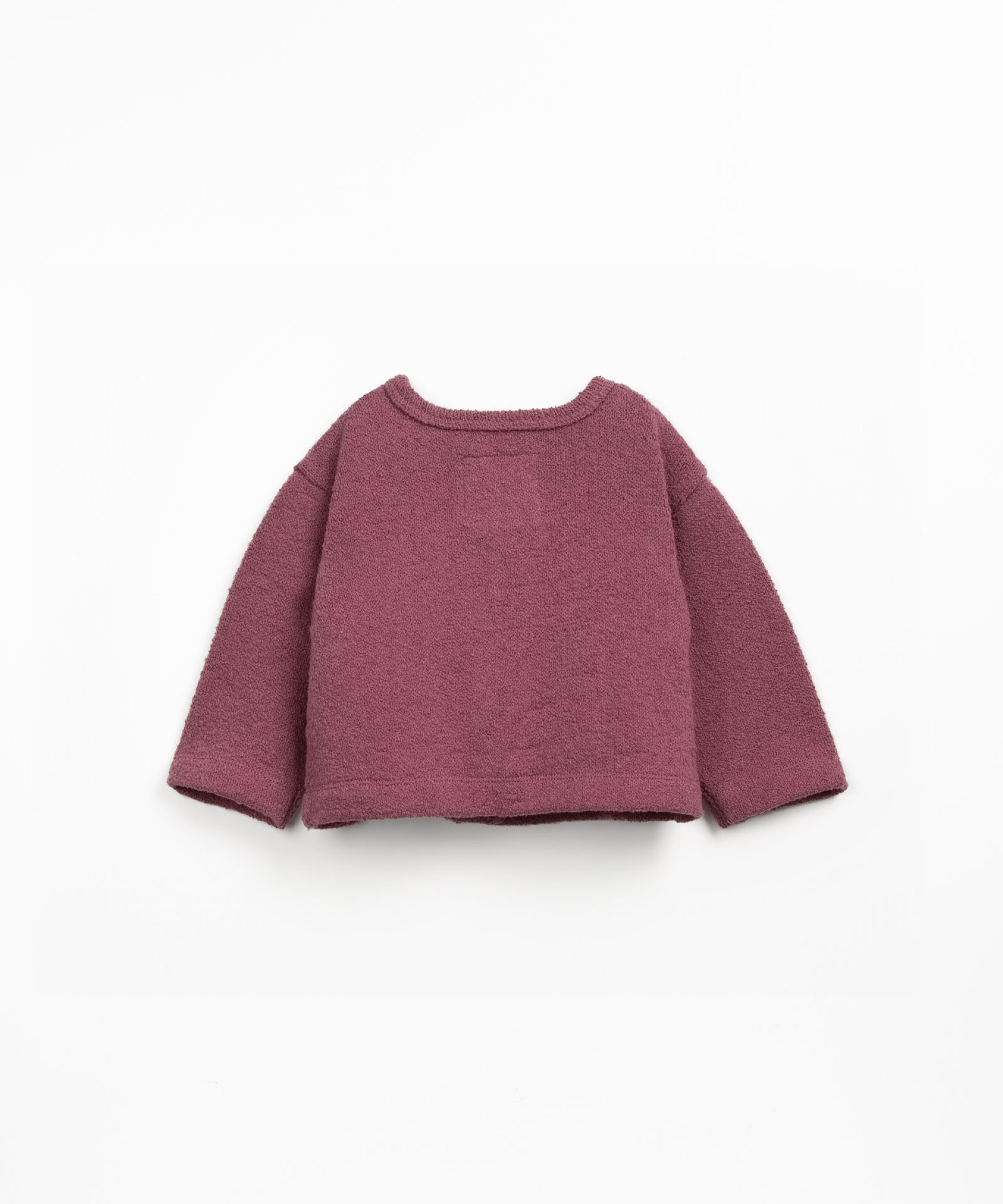 Knitted jacket with a blend of natural and recycled fibers