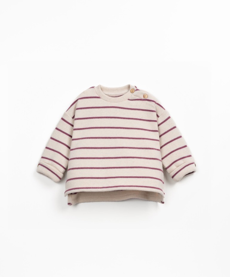 Striped knit sweater with shoulder opening