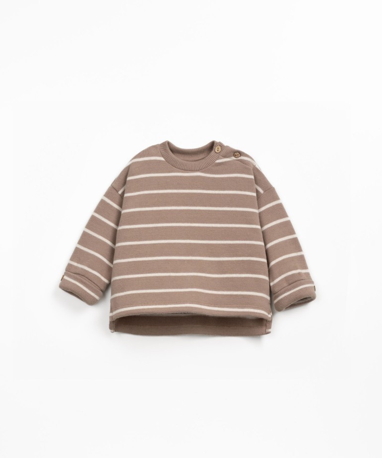 Striped knit sweater with shoulder opening
