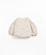 Sweater with rounded cut
