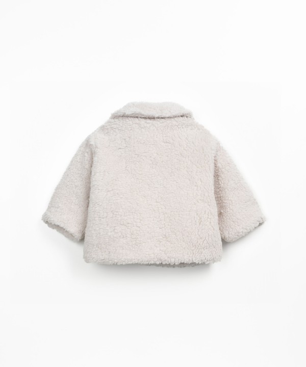 Fur coat with wooden buttons