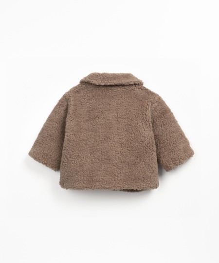 Fur jacket with wooden buttons