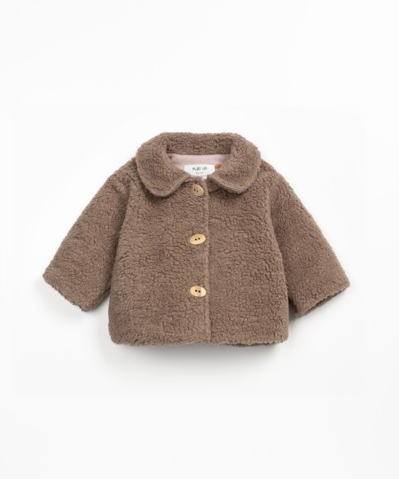 Fur jacket with wooden buttons