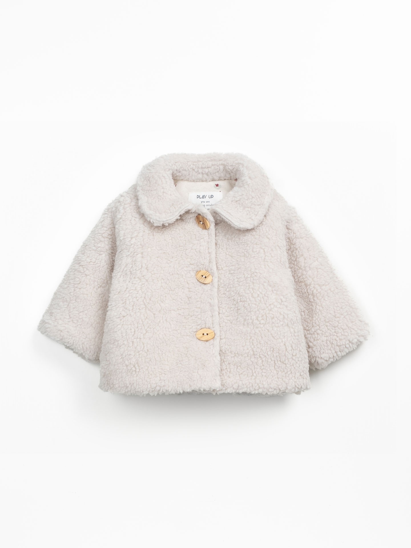 Fur coat with wooden buttons