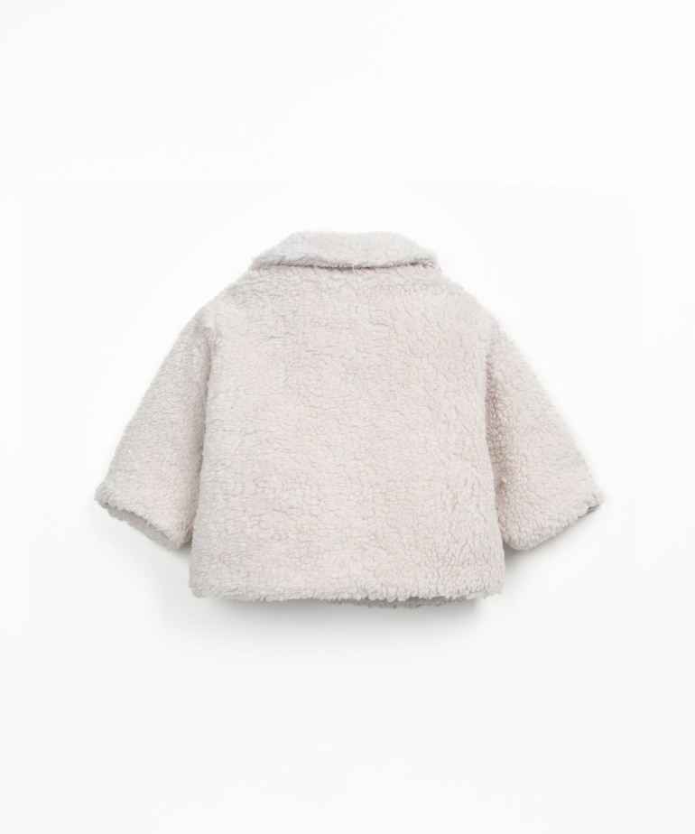 Fur coat with wooden buttons