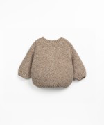 Knitted jacket with coconut buttons